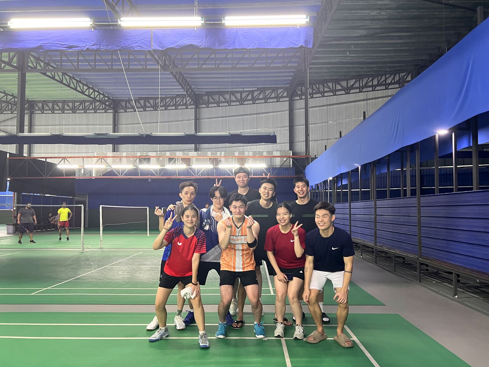 Adults enjoying a social badminton session